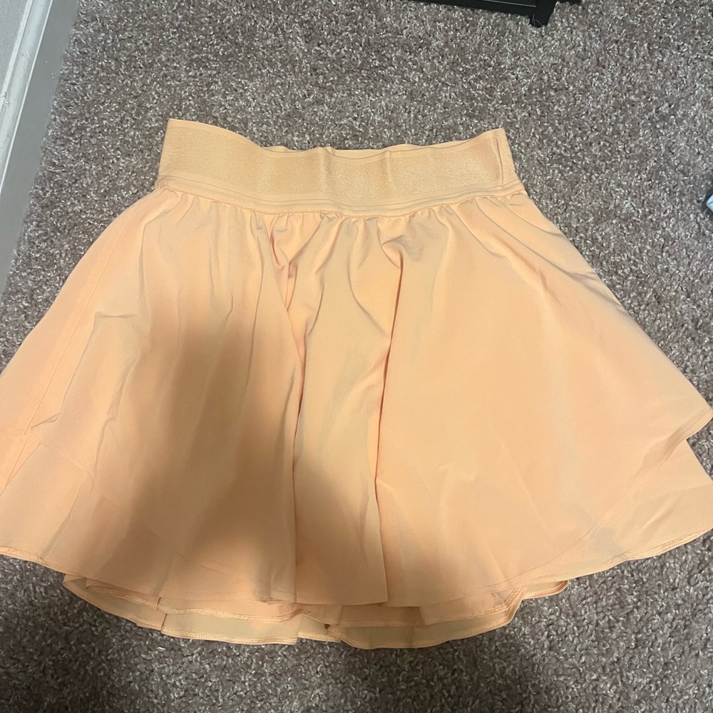Lululemon court rival high rise skirt in orange